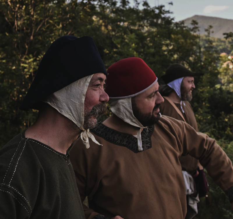 Three pilgrims scan the horizon